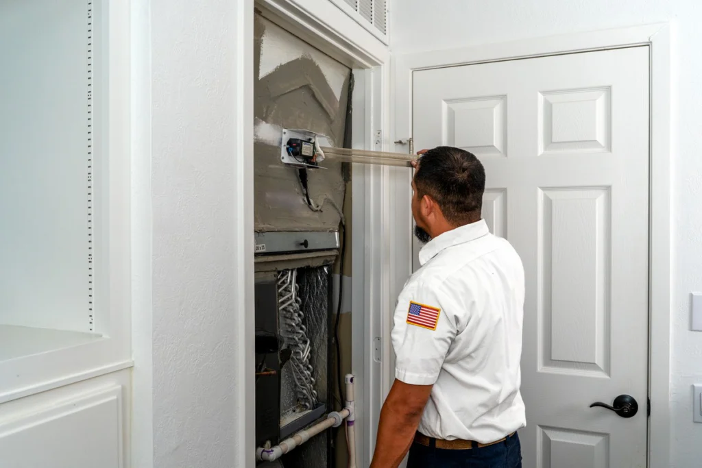 HVAC Technician Inspecting Residential Furnace System - Fredericksburg, TX