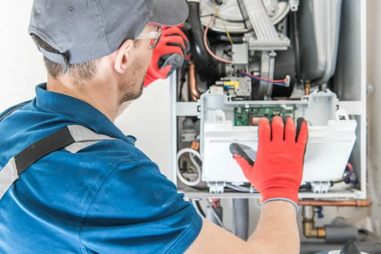 A tech working on a furnace repair