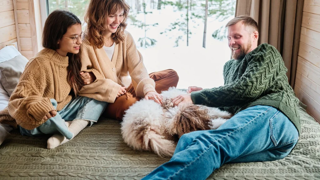 Happy family with dog in the house