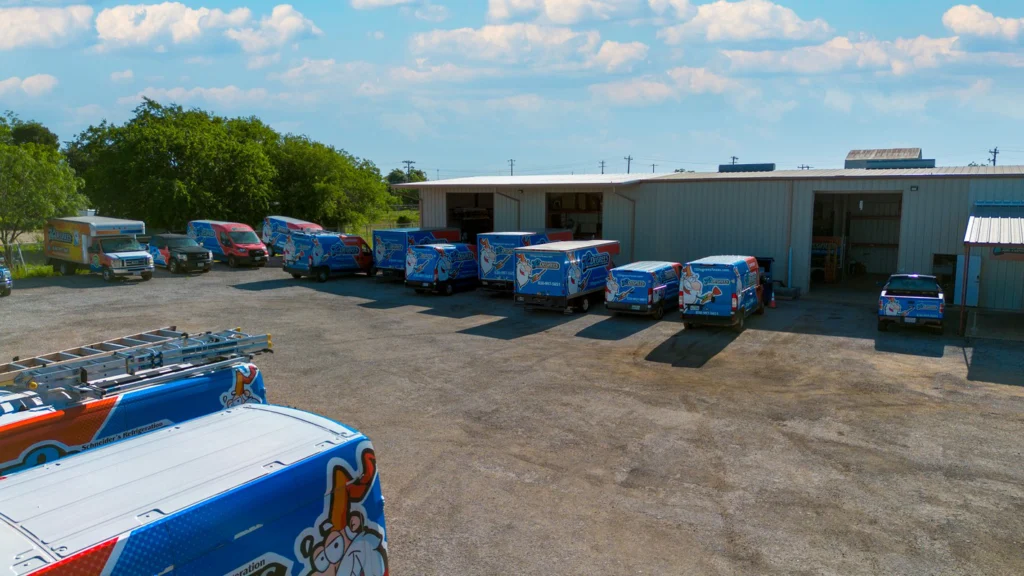Fleet of Service Vans at Company Facility - Fredericksburg, TX
