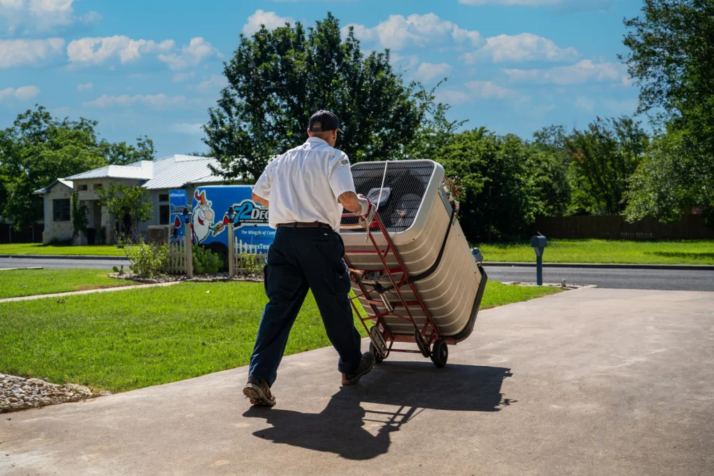 HVAC Professional Installing Air Conditioning Unit - Fredericksburg, TX
