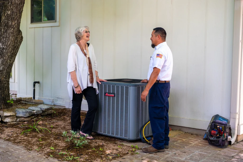 HVAC Technician Discussing AC Unit with Homeowner - Fredericksburg, TX