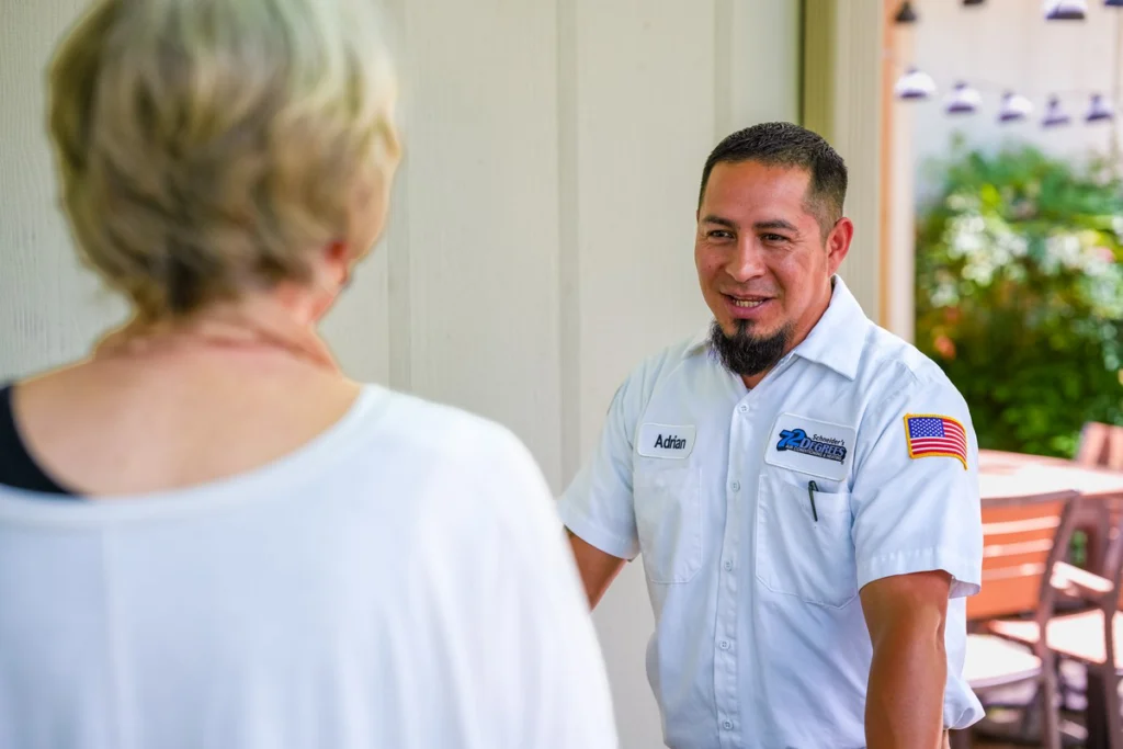 HVAC Technician Greeting Customer in Home - Fredericksburg, TX