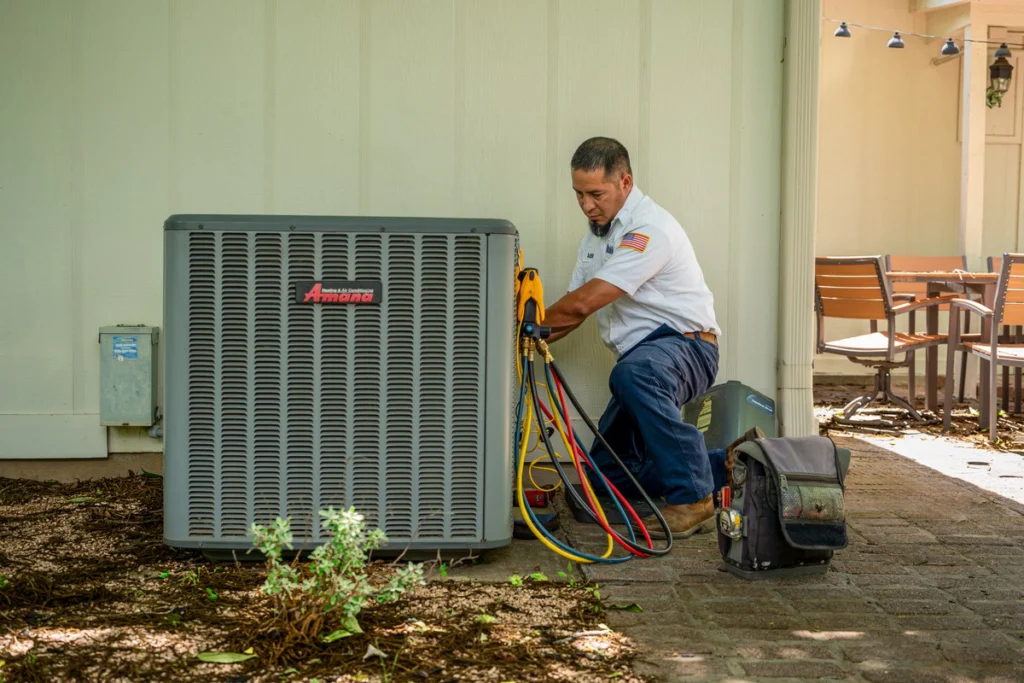 HVAC Technician Performing Air Conditioning Unit Maintenance - F