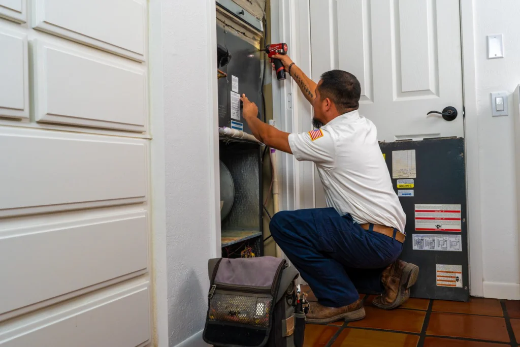 HVAC Technician Servicing Furnace Unit - Fredericksburg, TX