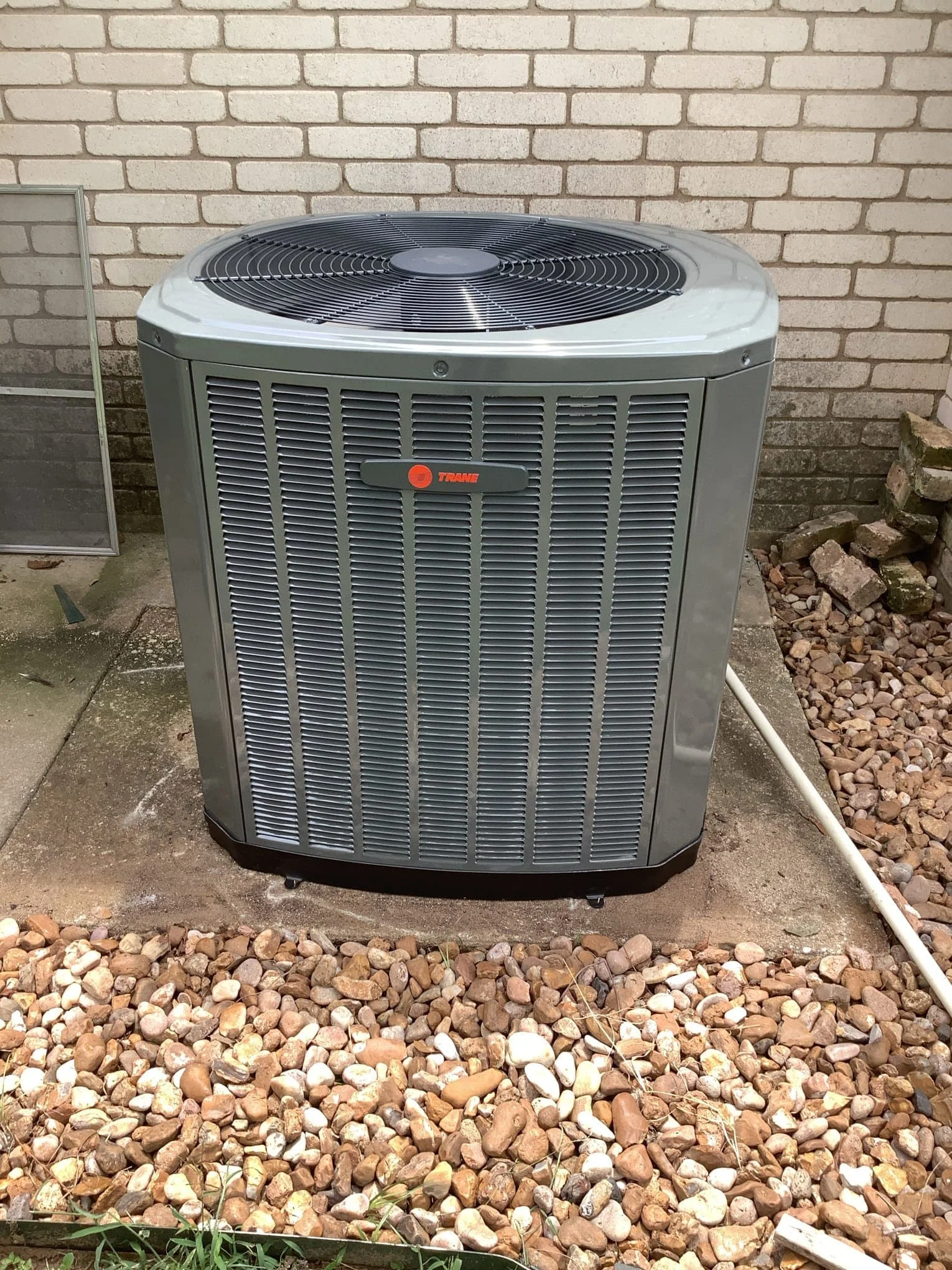 New Trane outdoor condenser installed outside home