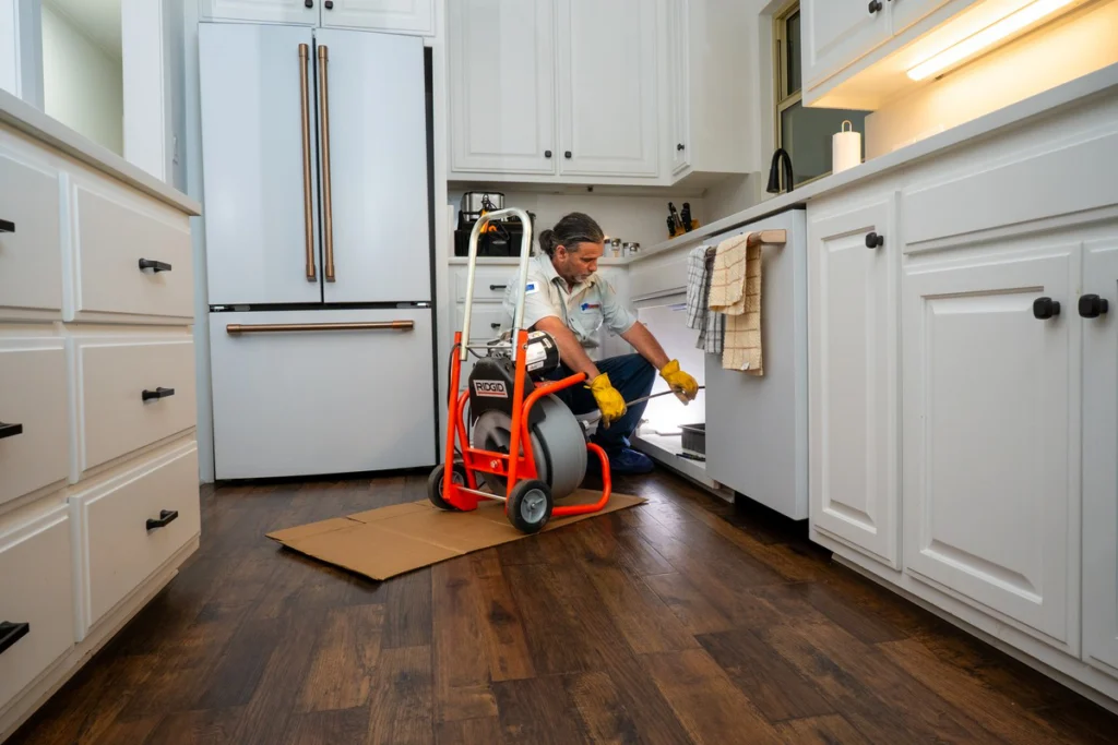 Professional Plumber Using Drain Cleaning Equipment - Fredericksburg, TX