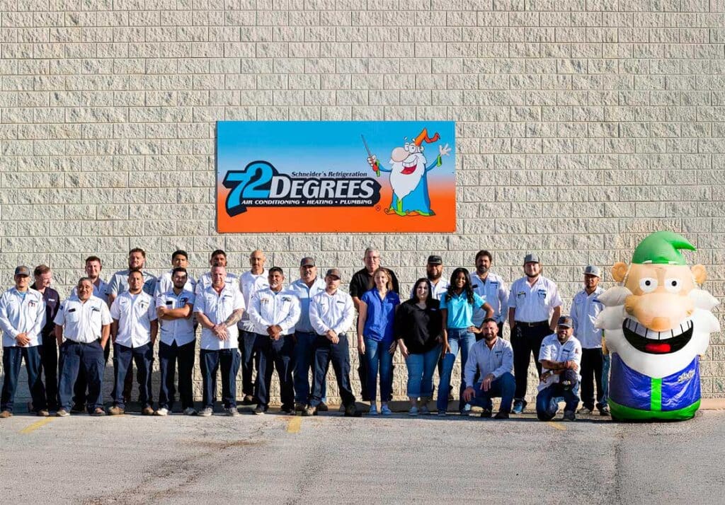 The 72 Degrees Texas team and mascot at their office in Fredericksburg, TX