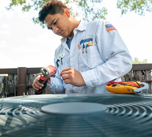 72 Degrees HVAC technician performs AC maintenance