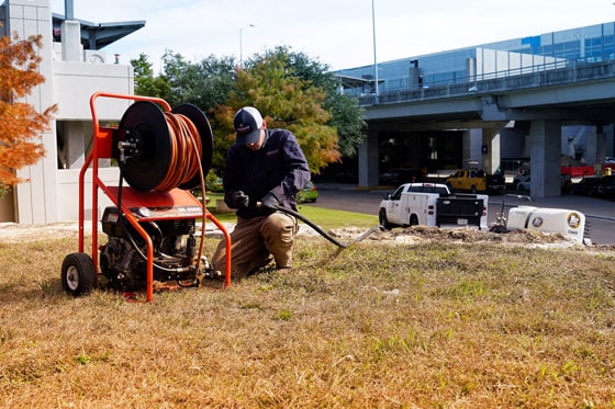 Radiant Technician sets up hose 560x373 2