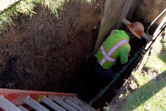 A tech working on a trenchless repair
