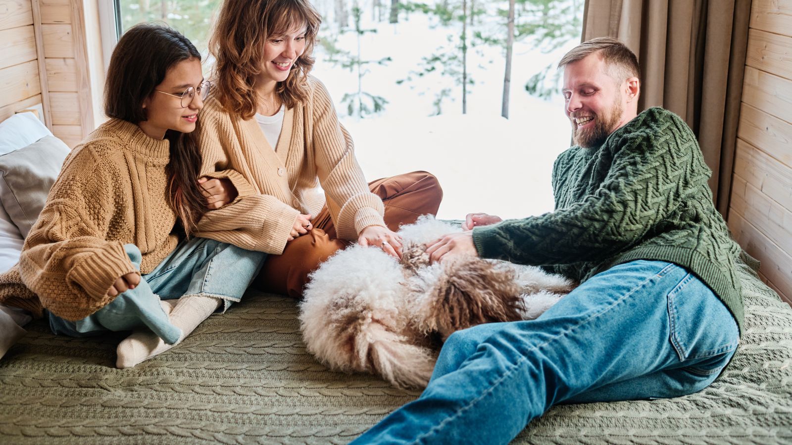 Happy family with dog in the house