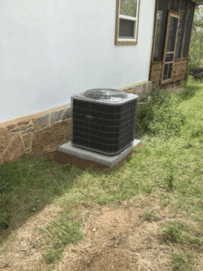 New heat pump condenser installed outside home in Johnson City TX