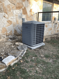New heat pump condenser installed outside home in Kerrville TX