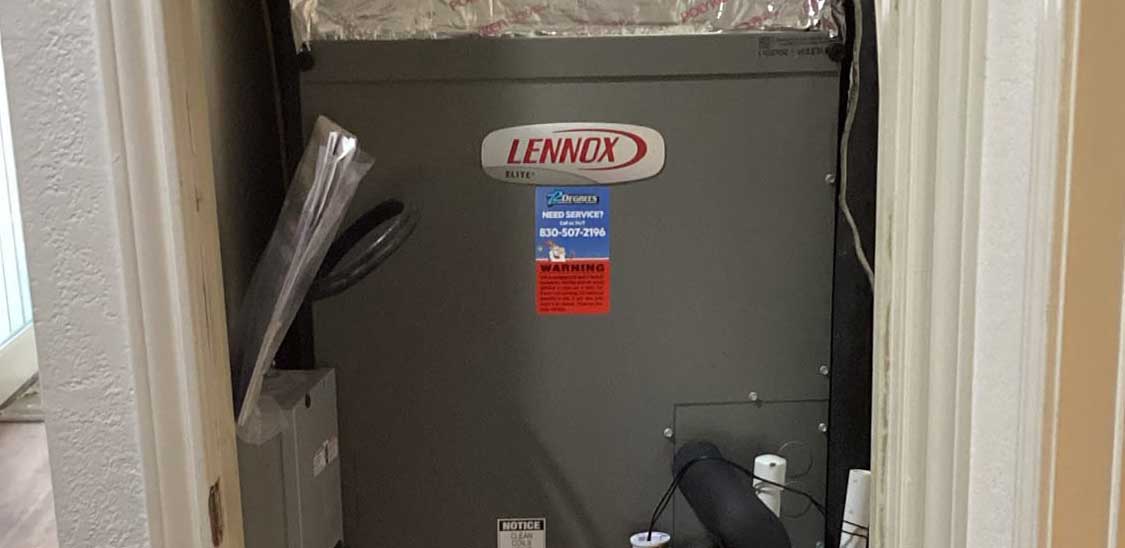 Detailed shot of the Lennox logo on the recently installed air handler in a home