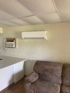 The head of a newly installed mini split in a living room