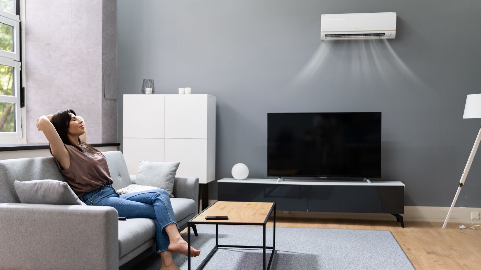 A woman comfortable indoors with a mini-split running