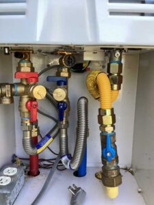 new tankless water heater connections installed for reliable hot water system