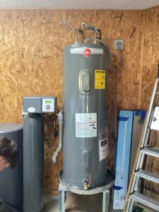 A Rheem water heater installed in a home's basement