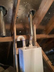 Navien NPE-240-A2 LP tankless water heater venting and piping installation in attic